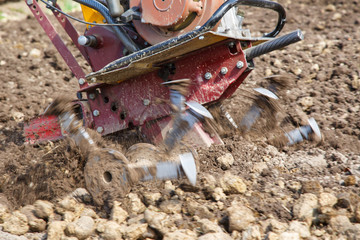 Motoblock plows soil
