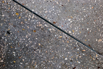 Texture of concrete floor background with small stones