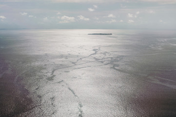 Tropical islands and atolls in Maldives in Indian Ocean from aerial view. Piece of paradise on the Earth. Good choice for vacation. Beautiful top view for wallpaper.