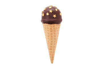 Chocolate cake pop in waffle cone for ice cream, decorated with gold confectionery sprinkles in the form of star. Isolated. Picture for a menu or a confectionery catalog.