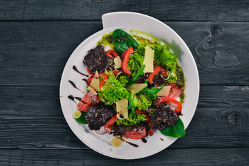 Beef Salad and Fresh Vegetables. On a wooden surface. Top view. Free space for your text.
