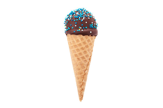 Chocolate cake pop in waffle cone for ice cream, decorated with blue and white confectionery sprinkles. Isolated. Picture for a menu or a confectionery catalog.