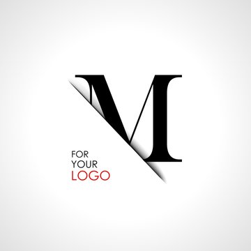 Capital m letter is inserted in the paper slot. To create logos, emblems, monograms.