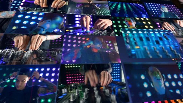 A DJ playing music on his mixer at a night club.