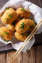 Japanese food: potato croquettes close-up. Vertical top view