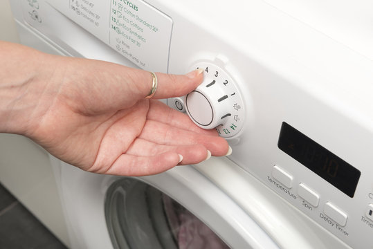 Hand Turning Timer Knob of a Washing Machine