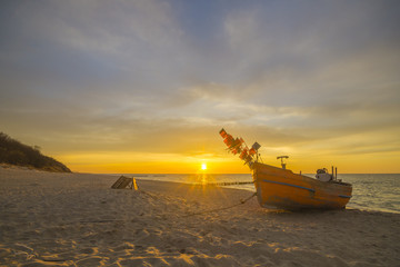 sunset over the sea beach,Fishing boats on the sand