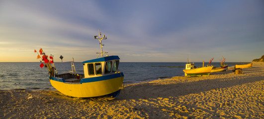 sunset over the sea beach,Fishing boats on the sand