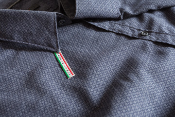 Made in Italy label on blue cotton shirt