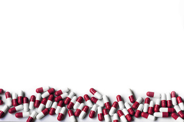 colorful of antibiotics capsules pills on white background, top view, copy space for text