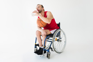 Fototapeta na wymiar Disabled basketball player drinking water