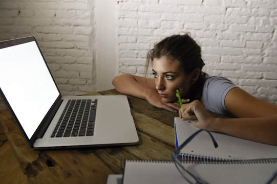 Young Student Girl Studying Tired At Home Laptop Computer Preparing Exam Exhausted And Frustrated Feeling Stress