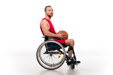 Fototapeta na wymiar disabled sportsman holding basketball ball
