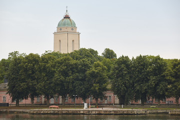 Suomenlinna harbor with church and lighthouse dome. Helsinki, Finland.
