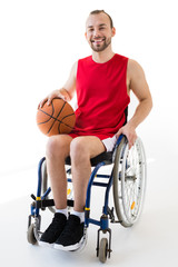Fototapeta na wymiar Disabled sportsman holding basketball ball