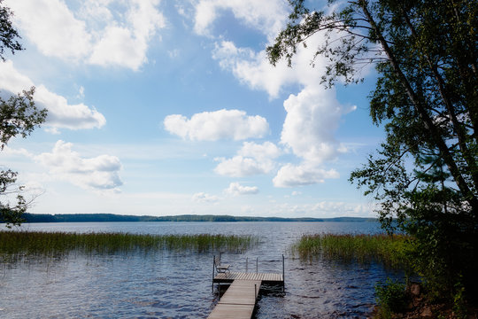 Jetty is on lake in summer day