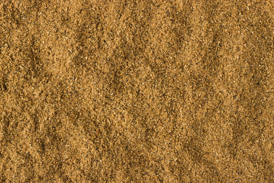 Cumin powder spice as a background, natural seasoning texture