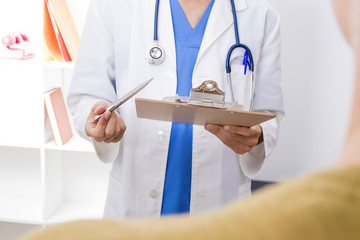 family doctor with patient in consultation