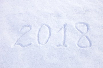 new year date 2018 written in snow background