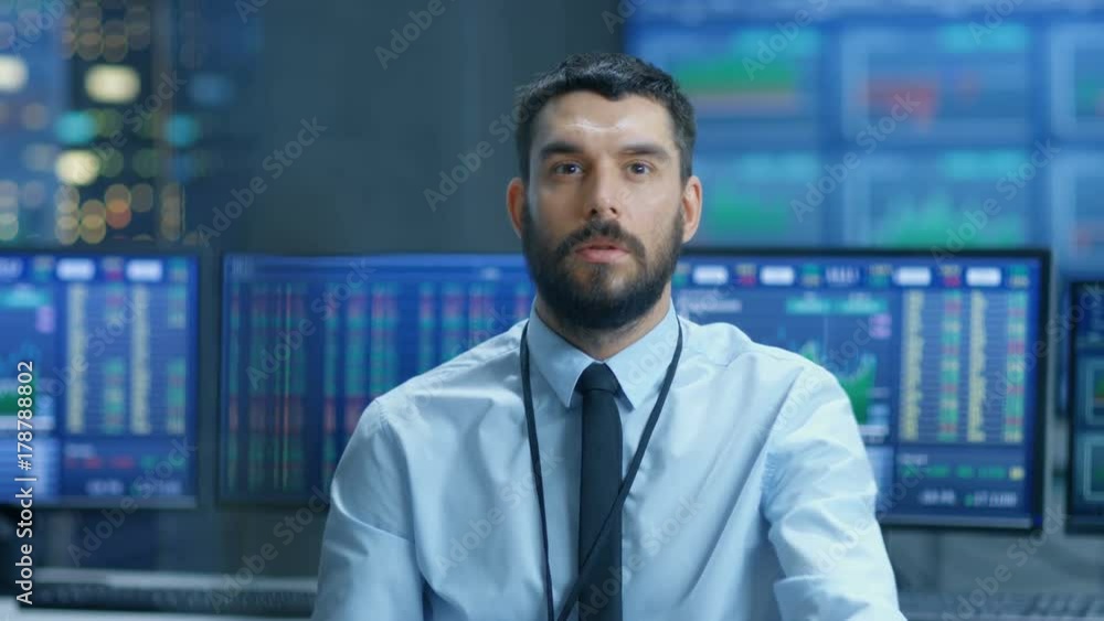 Poster stock market top trader thinking hard on selling stocks at the best time. behind him people working 