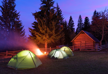Three tents lighted from the inside