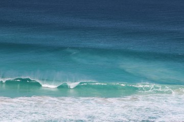Blue, turquoise and white ocean water background