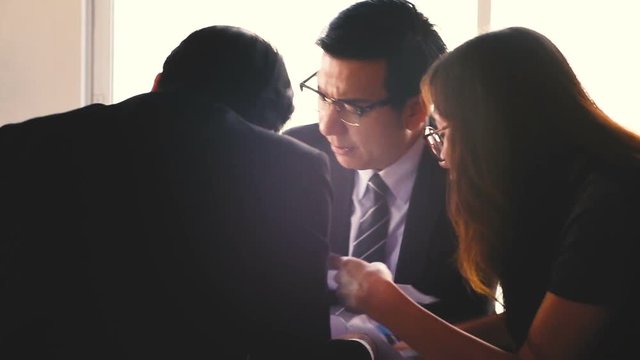 Business asian staff group arguing in boardroom meeting, trying to blame each other for a business failure.