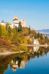 Obraz premium Nidzica Castle over lake in Poland