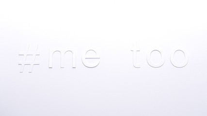 paper letters of #metoo on a white cardboard