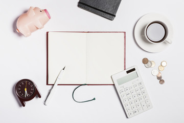 note spread with stationary on the white background.