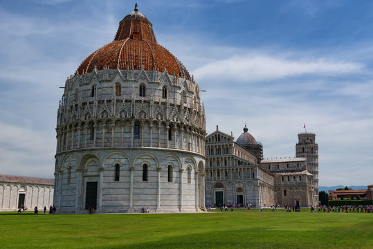 Stunning daily view at the Pisa Baptistery, the Pisa Cathedral and the Tower of Pisa. They are located in the Piazza dei Miracoli (Square of Miracles) in Pisa, Italy. © djevelekova