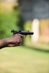 Outdoor shooting with a 9mm pistol in a shooting range