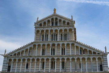 Fototapeta na wymiar Details of the exterior of the Pisa Cathedral (Cattedrale Metropolitana Primaziale di Santa Maria Assunta; Duomo di Pisa in italian), Pisa, Tuscany, Italy