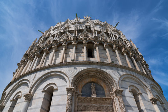 Details of the exterior of the Pisa Baptistery of St. John, the largest baptistery in Italy, in the Square of Miracles (Piazza dei Miracoli), Pisa, Italy.
