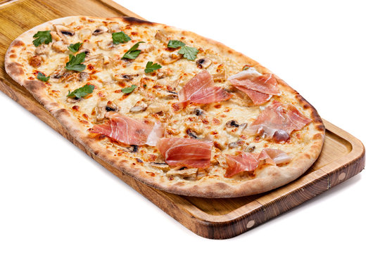 Italian pizza on a wooden chopping board.