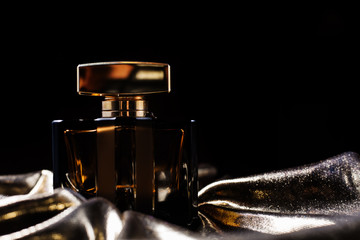 bottle of golden female perfume