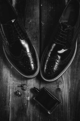 mans shoes with perfume in black and white