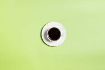 coffee cup on the green background.