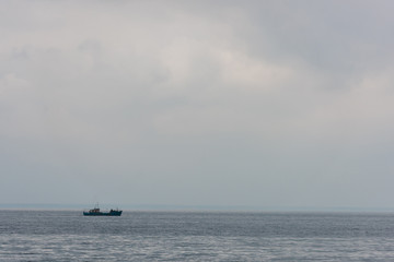 lonely ship floating in sea