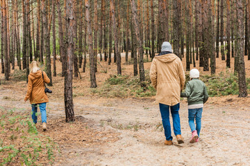 family walking by forest