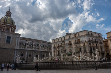 Fototapeta na wymiar Baroque fountain with nude figurines on piazza Pretoria in Palermo, Sicily, Italy