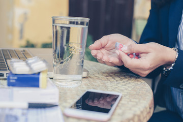 Business woman on medication working. Using tablets.
