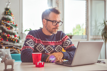 Men using laptop at home office
