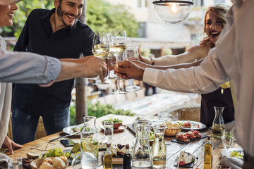 Friends Rising Glasses at Outdoor Party