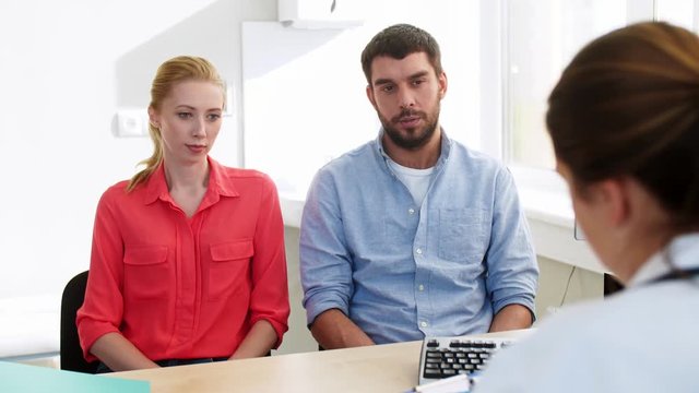 couple visiting doctor at family planning clinic