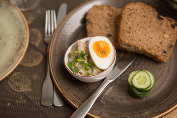 farshmak with bread, cucumber and half cooked egg