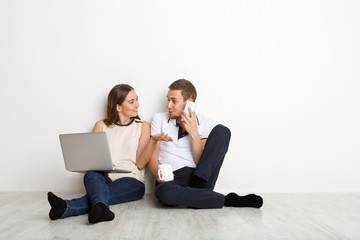 Couple shopping online with digital tablet