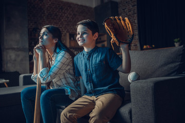 family watching baseball at home