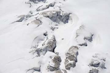 Glacier crevasses and seracs in a snow field in the Mont Blanc area.