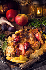 Fototapeta na wymiar Chicken pieces with fruit and vegetables from the oven